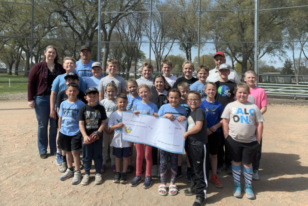 Hildreth Ball program players receive a check from Operation Round Up.